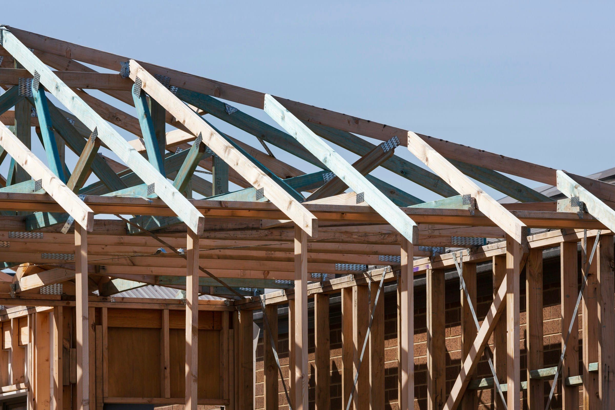 Roof trusses set on the framed walls of a new home